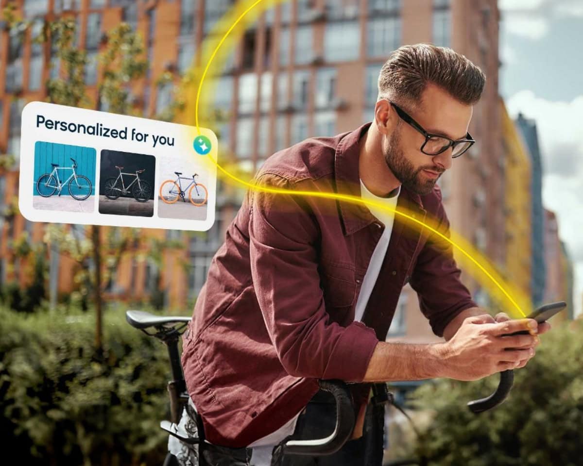 Man on bike looking at phone